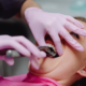 Patient smiling confidently after receiving dental implants in Vancouver